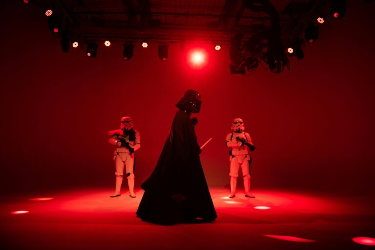People in Star Wars Characters Costumes Standing on Stage Photo Credit: Andres Garcia via pexels.