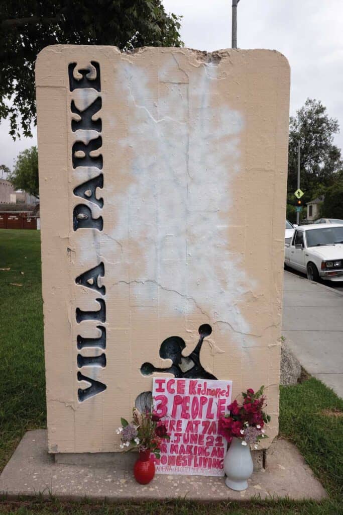 A hand written memorial marks the site where three people were arrested in an immigration sting a few hours earlier, Pasadena, June 21, 2025.