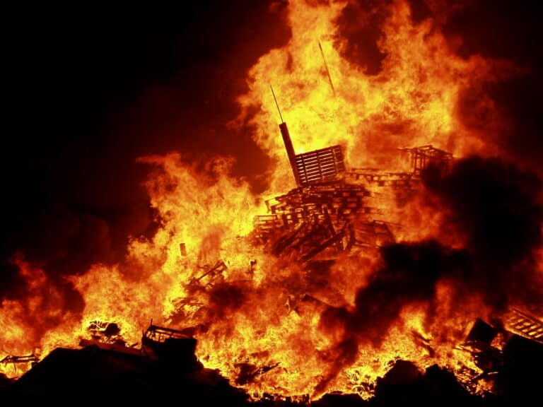 An Eleventh Night bonfire in Belfast, Northern Ireland is lit on fire as part of an Ulster Loyalist celebration. 2006. Photo Credit: Kindonnelly via wikimedia