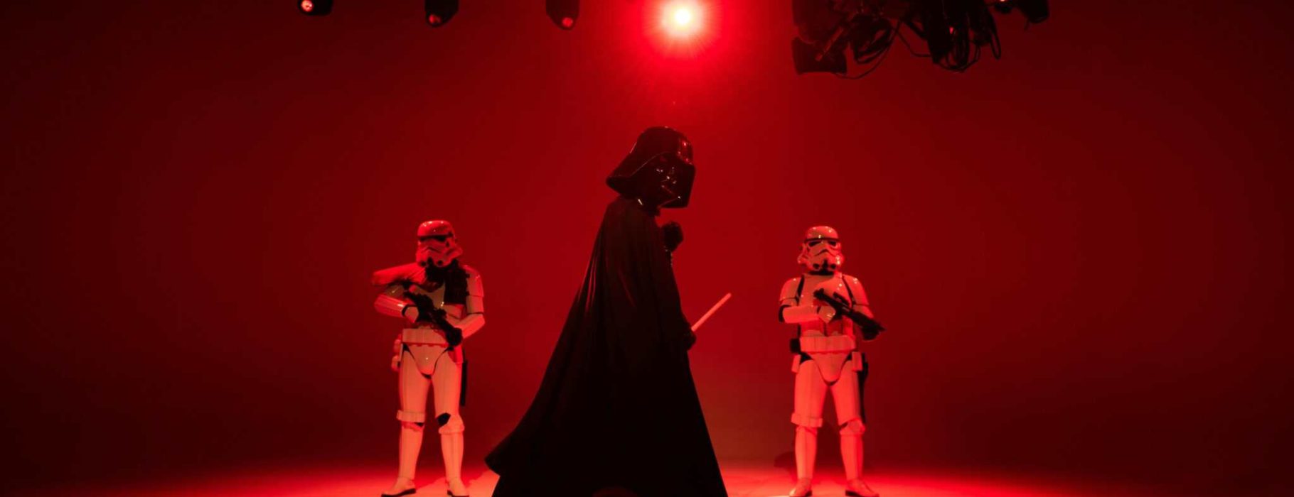 People in Star Wars Characters Costumes Standing on Stage Photo Credit: Andres Garcia via pexels.