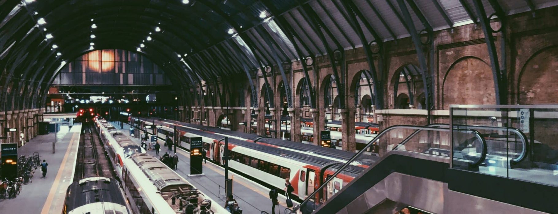 Photograph of a large, modern train station in England.