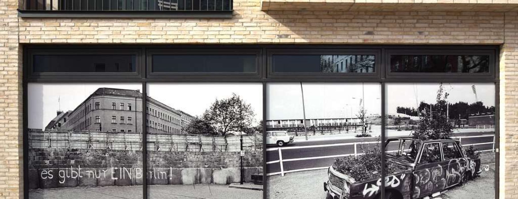 Berlin Wall vs Fall of the Wall poster on a wall at the Schwedter Straße in Berlin, Germany (2022). Via wikimedia commons