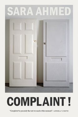 The book cover of Complaint! By Sara Ahmed, featuring a photo of two off-white doors leaning against a wall.